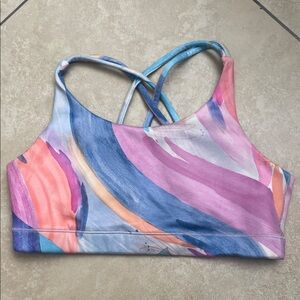 Athleta Girl Upbeat sports bra w/ cross-back design, abstract watercolor print